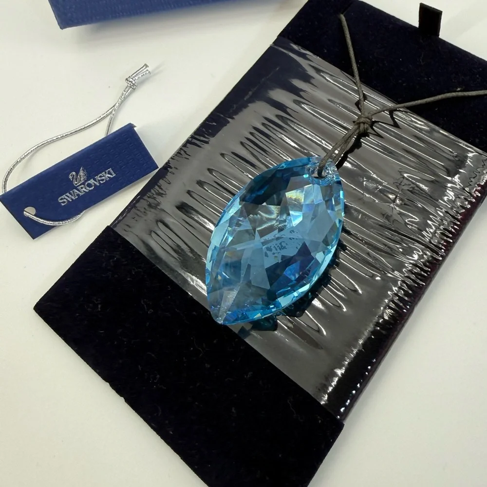 SWAROVSKI Aqua Scuro Crystal Teardrop Pendant Necklace On Black Cord-5083475